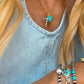 Gold cross necklace by Turnback pony