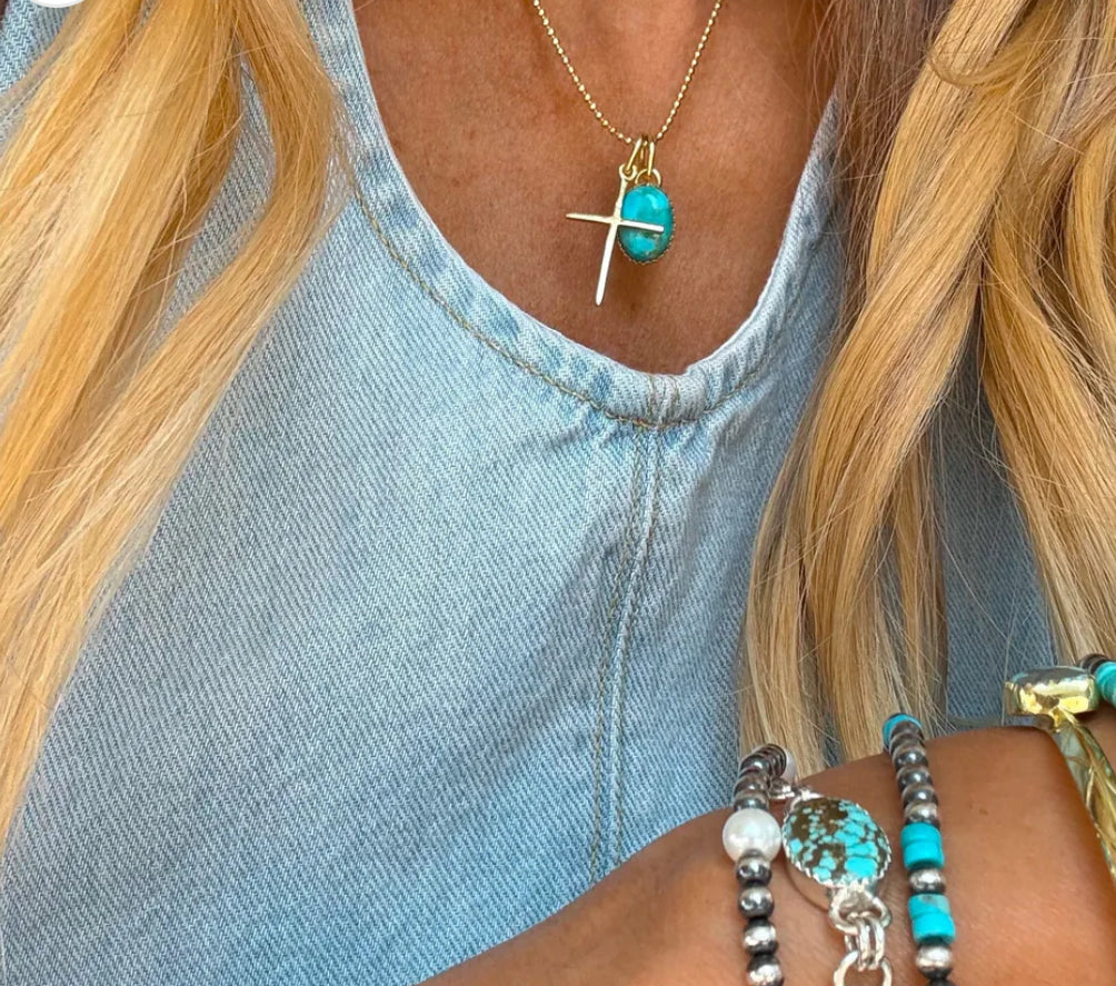Gold cross necklace by Turnback pony