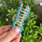 Faux turquoise bow claw clip