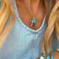 Gold cross necklace by Turnback pony