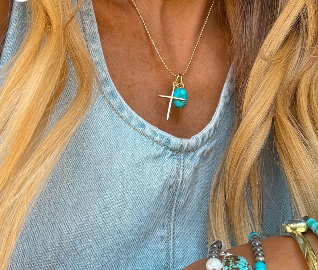 Gold cross necklace by Turnback pony
