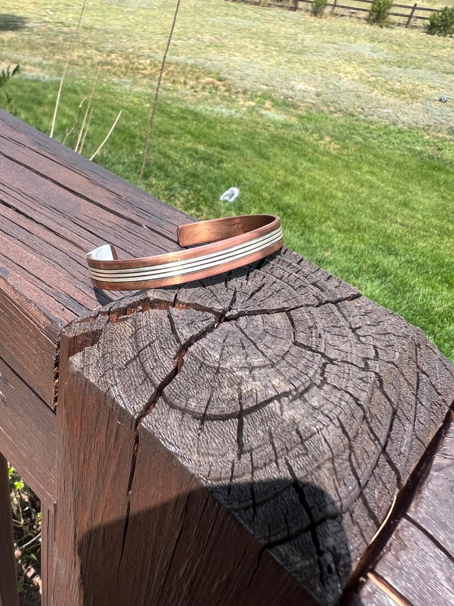 Copper and sterling silver cuff by Wylie Secatero 6.75”