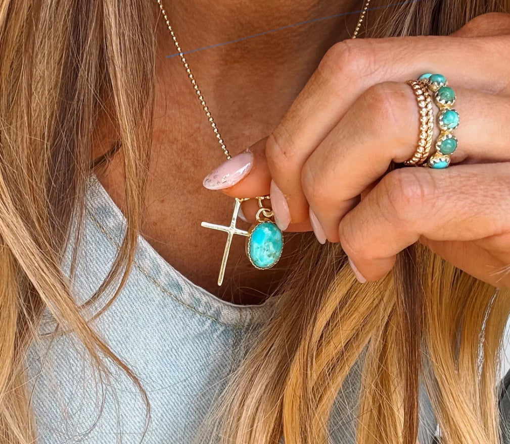 Gold cross necklace by Turnback pony
