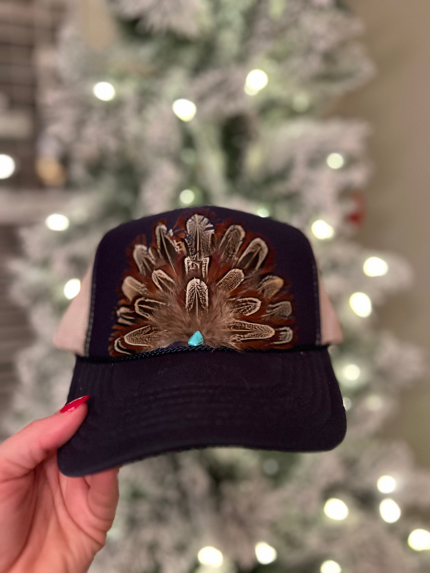 Feather trucker hat by Tammi