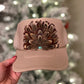 Feather trucker hat by Tammi