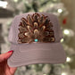 Feather trucker hat by Tammi