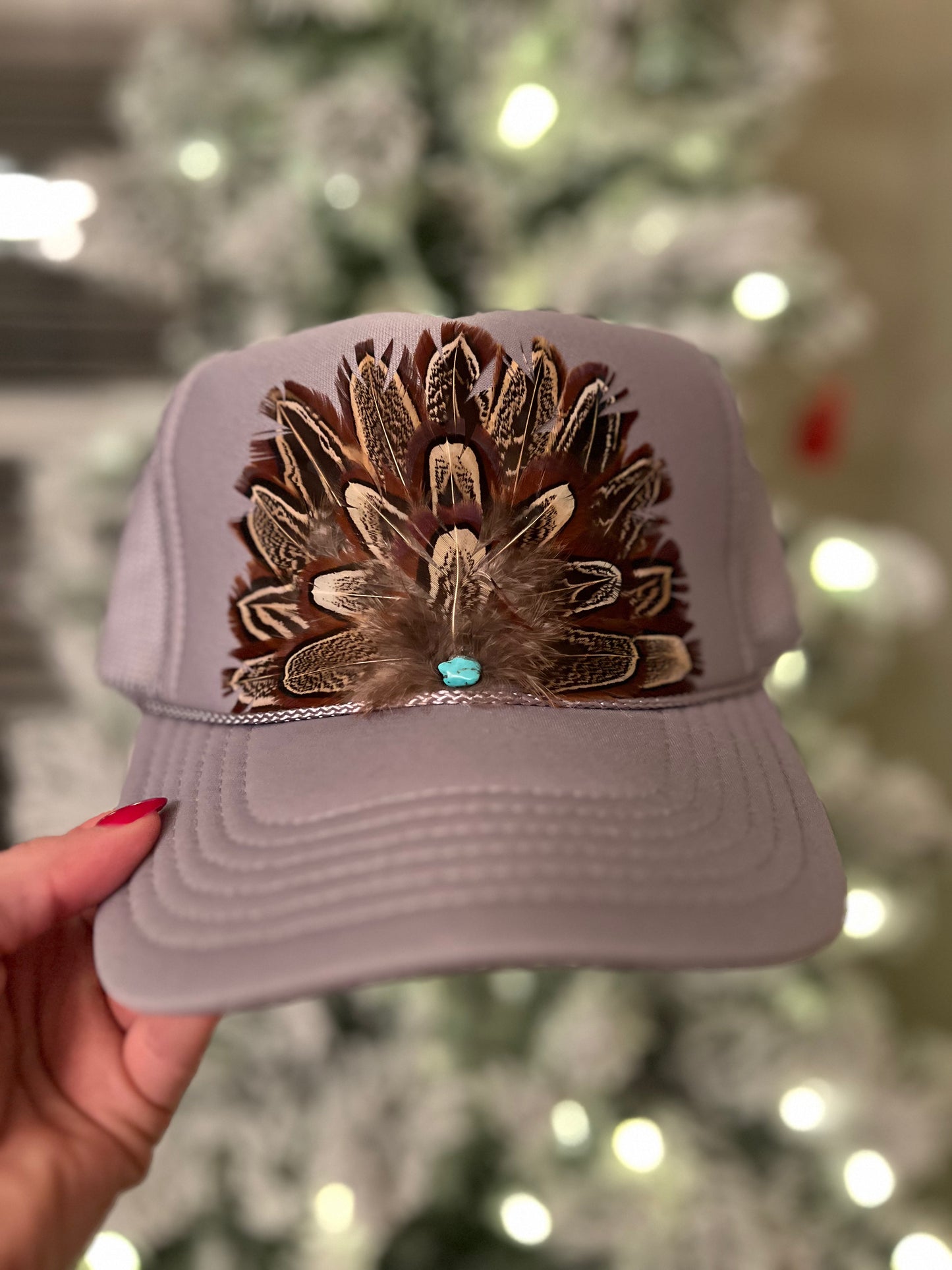 Feather trucker hat by Tammi