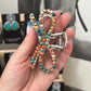 Bow multi colored faux stone claw clip